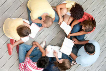 group of kids reading in a circle