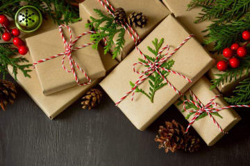 A group of wrapped presents under the tree