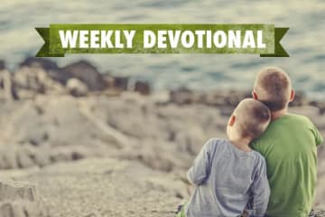 Two boys sitting on a mountain under the Weekly Devotional banner