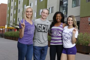 four GCU students smiling