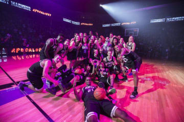 GCU basketball players huddling at a game