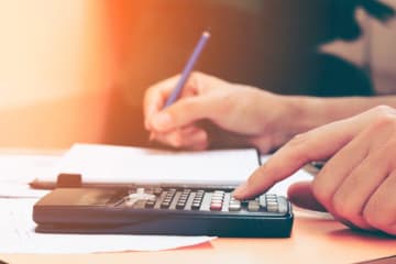 A student doing tuition calculations