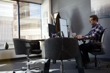 sustainable company leader sitting in his office