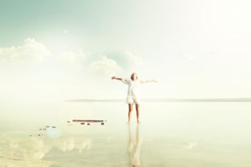 A woman walking joyfully on reflective water