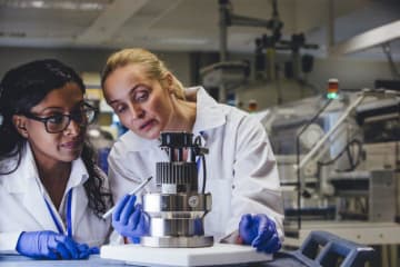 Two biomedical engineers working in a lab