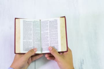 Bible and Hands