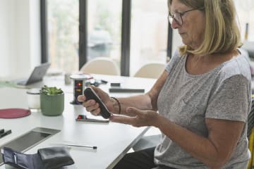 Woman checking her blood sugar levels