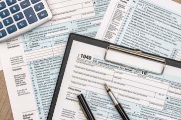 tax forms and paperwork on a table