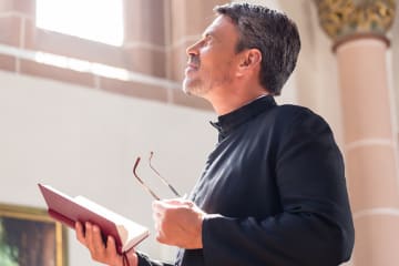 Pastor meditating on God's word at church