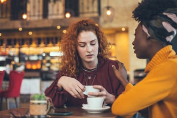 Two girl friends meet for coffee and show confession is good for the soul