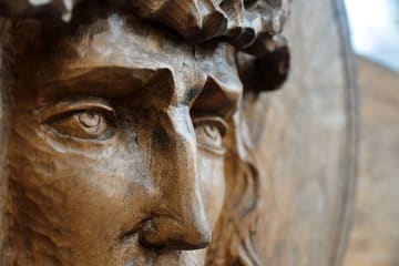 Closeup of a wooden Grecian or Roman statue