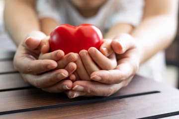 parent and child holding heart for soul care