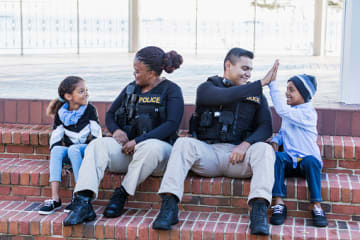 police officers inspiring children