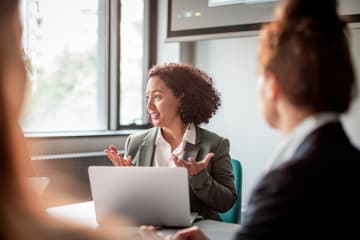 presenter explaining thought leadership to coworkers