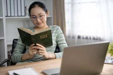 girl working on emotional health by reading the Bible