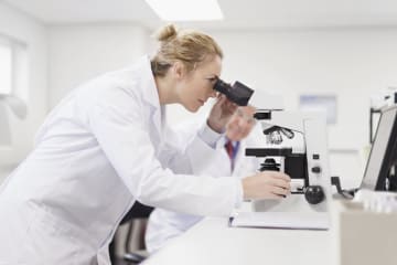 Female pathologist researches the causes of illnesses