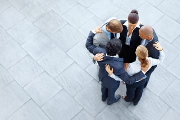 business people praying from God's perspective