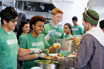 Volunteers in soup kitchen experiencing the gift of work