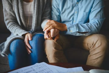 couple showing love and forgiveness by holding hands