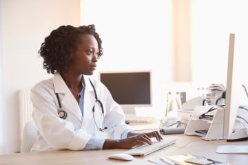 clinical research specialist working on the computer