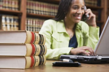 Female paralegal working in library