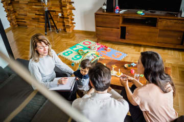 Foster family talking with social worker