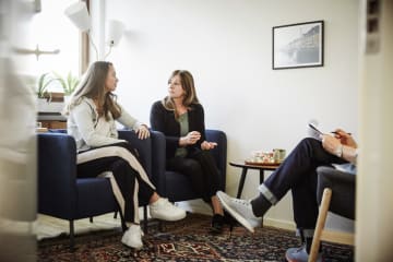 Mother and daughter speaking with psychologist