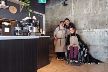 Three employees at coffee shop with conscious company culture