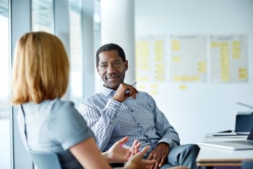 Human resources specialist talking to employee