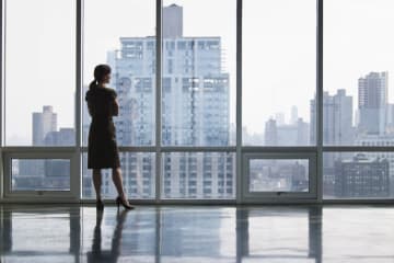 Businesswoman looking out window 