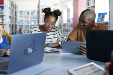 A group of EdD students studying in the library 