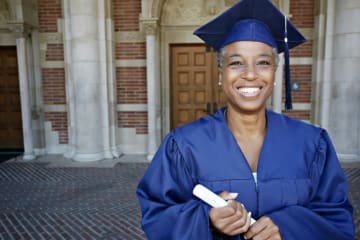 Adult female graduating with her EdD degree