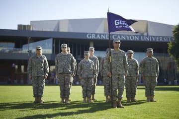 army students standing in front of the GCU Arena
