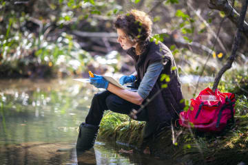 Environmental protection specialist analyzes a water sample