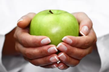 Dietitian holding apple