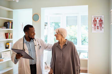 Geriatrician with elderly patient