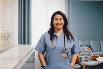 Nurse smiling in office