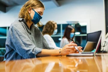 female nursing student studying for NCLEX exam