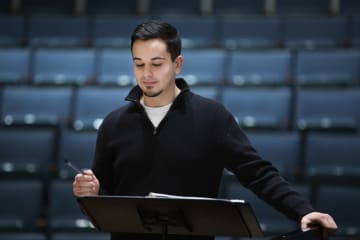 Musical director reading over music