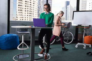 Two people working in a collaborative work space