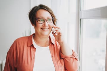 Happy women talking on the phone