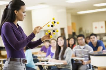 female teacher demonstrating to students