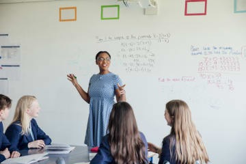 female teacher using literacy in mathematics content instruction