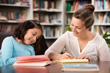 A reading specialist working one-on-one with a student