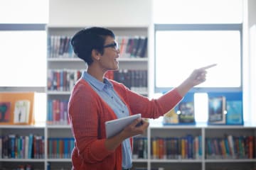 Female teacher instructing her students