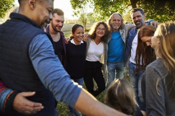 Group of believers linking arms and finding strength in numbers