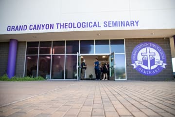 Grand Canyon Theological Seminary grand opening with outside view of doors open at 27th Ave and Camelback Road 