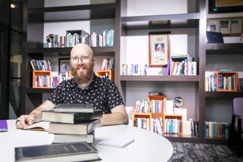 GCU history major sitting at library