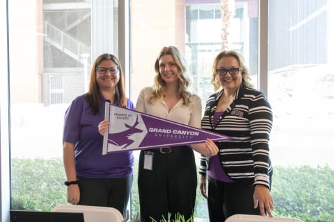 group of HR women smiling for photo at career fair