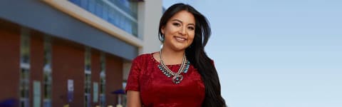 Female Native American student smiling outside on GCU's campus